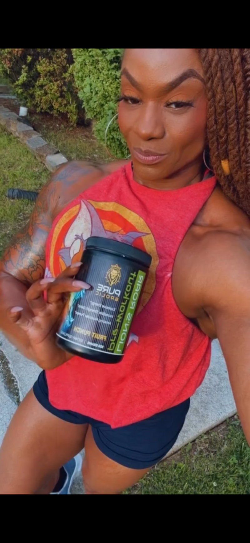 Person holding a supplement container outdoors