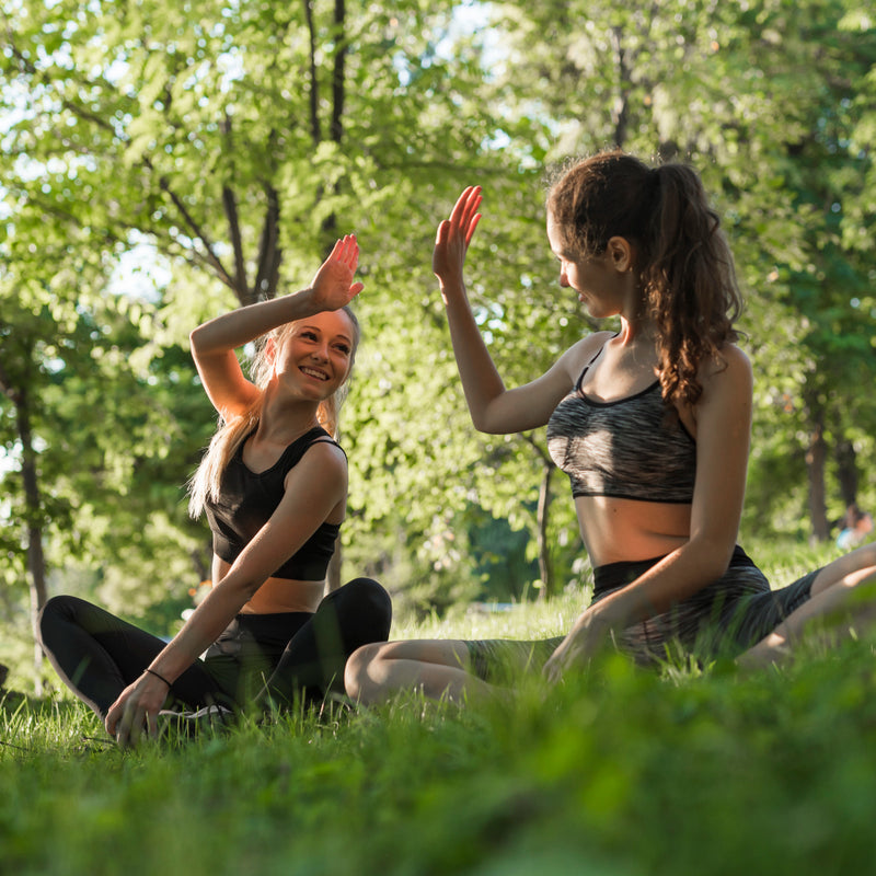 Two women giving high fives